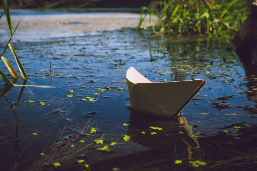 white paper boat on pond