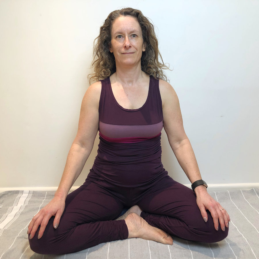 woman sitting in yoga perfect pose